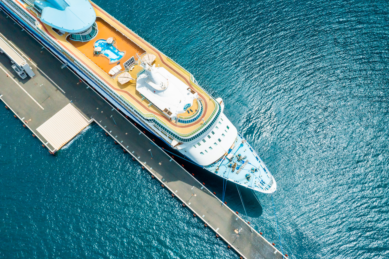 Top view of a large cruise liner ship with swimming pool moored in marina of Adriatic sea